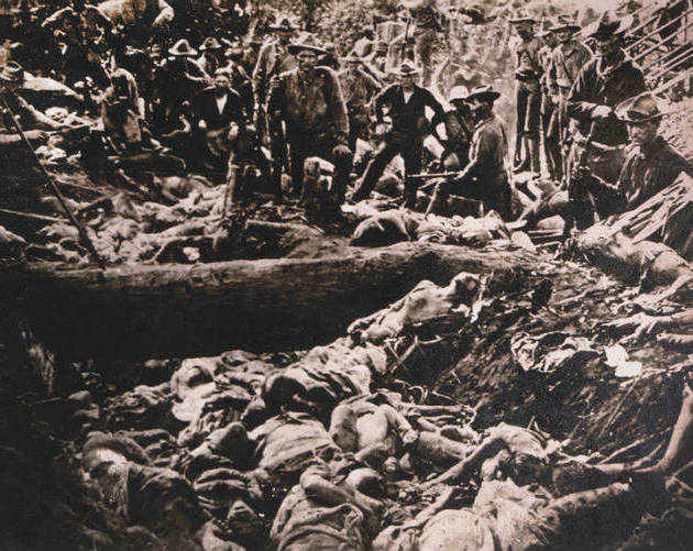 American Soldiers Inspect Insurgent Casualties